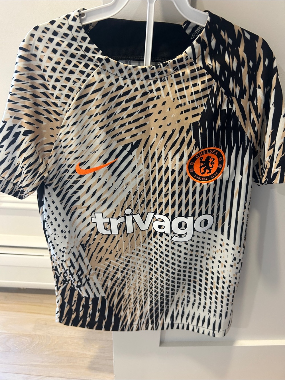 Nike Kids' Chelsea Short Sleeve Jersey in Black, Tan & Orange
